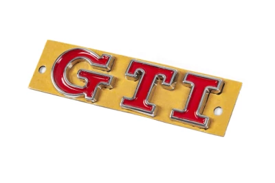 Emblemat z napisem "GTI", 90×25 mm, AVTM, 6459003B