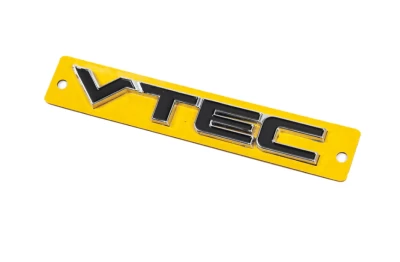 Шильдик (напис) "VTEC", чорний із хромом, 110х15 мм, AVTM, 6457236E
